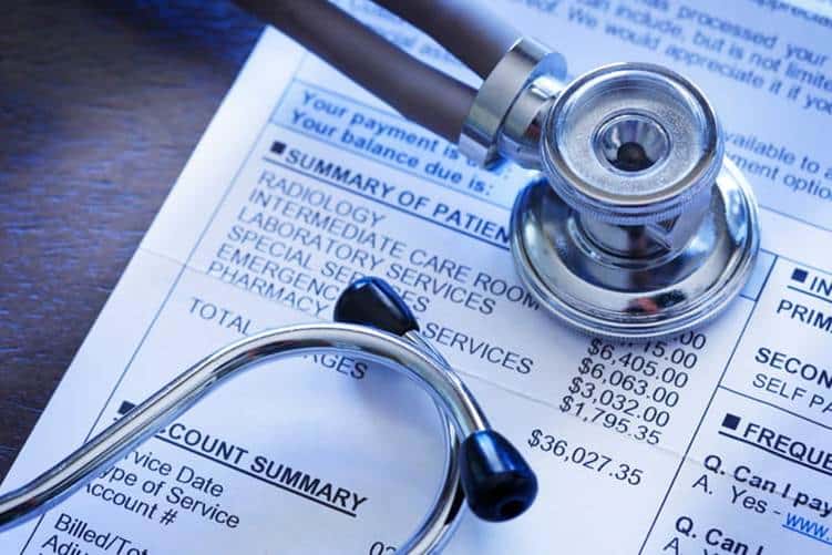 How Medical Liens Work In Las Vegas 21 A stethoscope on top of a medical bill.