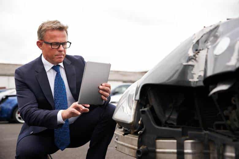 What Happens If You Total A Leased Car In Las Vegas? 22 A car accident lawyer documents damage to a leased vehicle after an accident.
