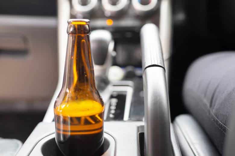 Open Container Law In Las Vegas 19 An open beer bottle in the cupholder of a car.